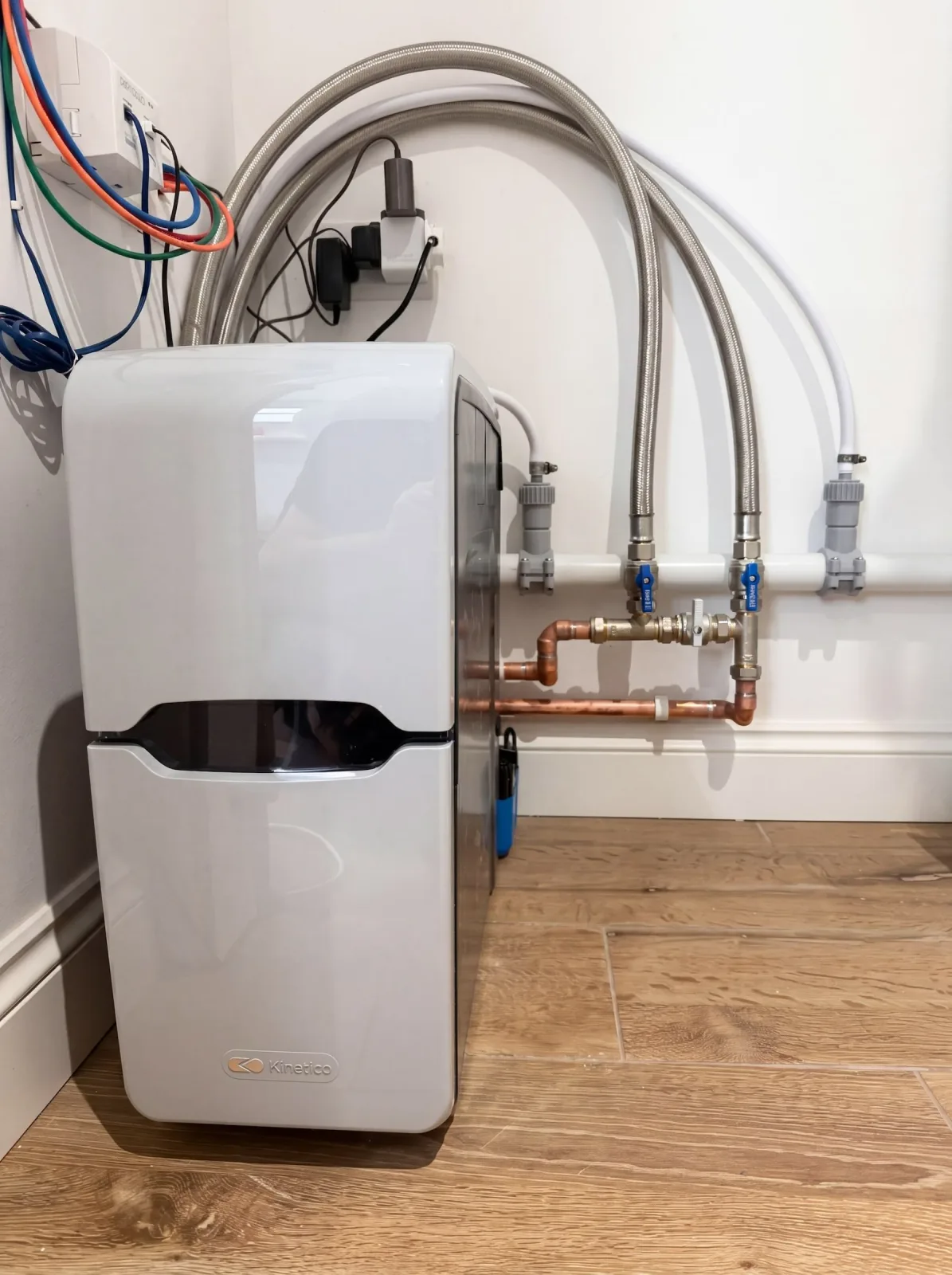 Kinetico block-salt water softener installed in an airing cupboard, Chandlers Ford